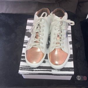Women’s size 8.5 high top sporty sneakers.